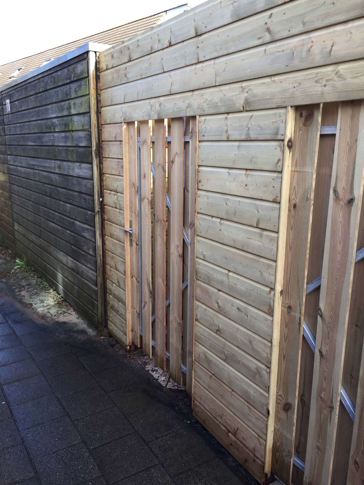 Schutting met dubbele poortdeuren